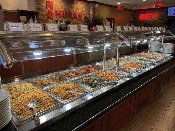 All-you-can-eat buffet line at Hunan Restaurant with HUNAN BUFFET sign